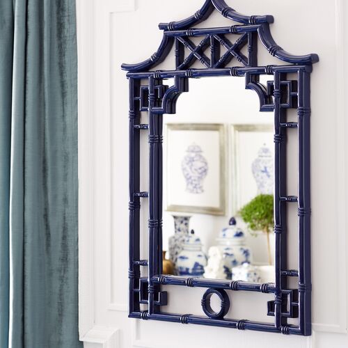 A modern take on traditional chinoiserie motifs, this impressive wall mirror is set in a pagoda frame with bamboo-style details and a glossy cobalt finish.