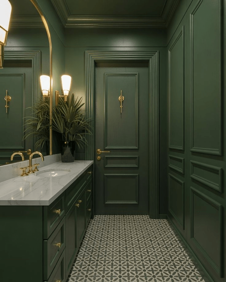 "Stylish bathroom with deep green paneled walls, marble countertop vanity, and gold fixtures. Modern interior design featuring patterned tile flooring, arched mirror, wall sconces, and indoor plant decor for a sophisticated and timeless bathroom look."