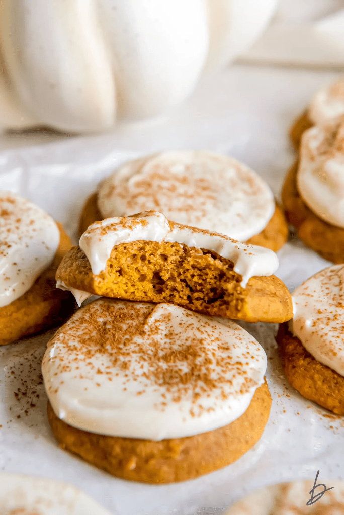 “Soft pumpkin cookies topped with creamy cream cheese frosting and sprinkled with cinnamon. Moist and fluffy fall cookies perfect for Thanksgiving dessert tables, cozy autumn baking, or pumpkin spice lovers.”
