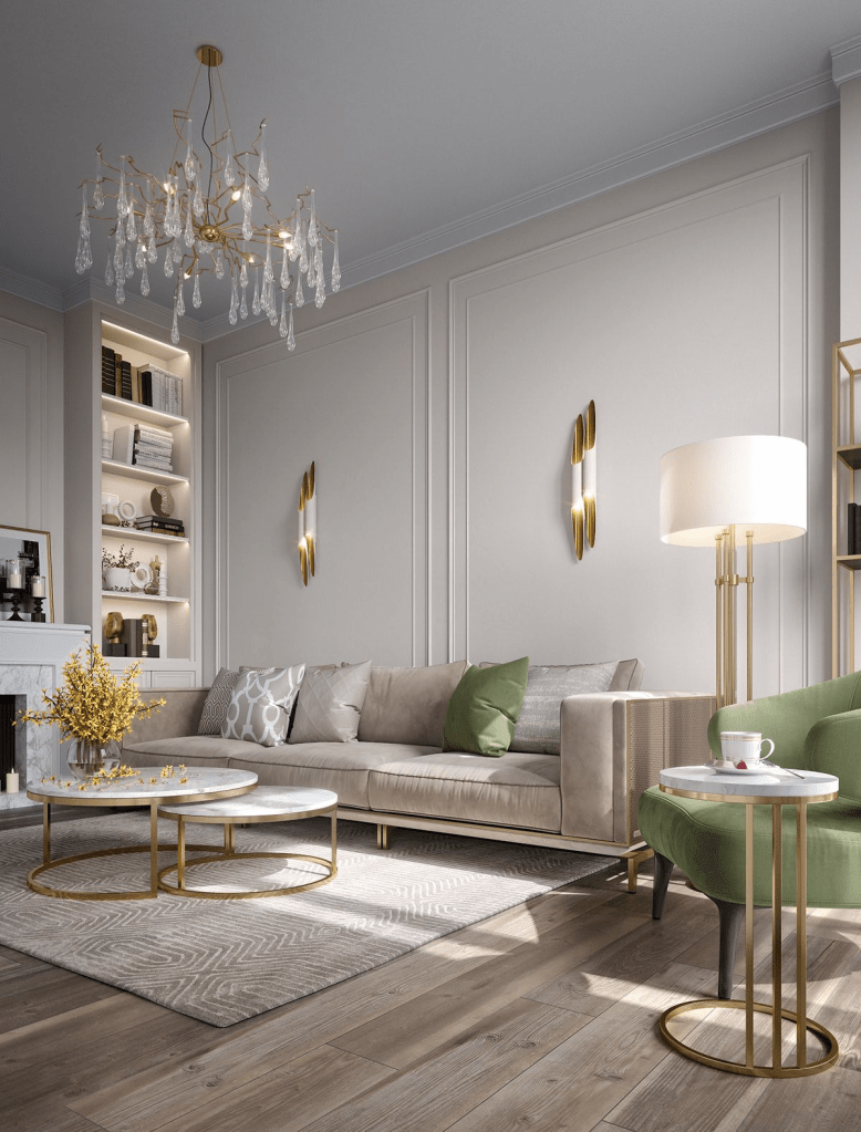 Elegant modern living room with neutral beige sofa, green accent chair, gold chandelier and brass wall sconces, luxury contemporary interior design with soft gray walls, layered lighting, and refined minimalist decor.