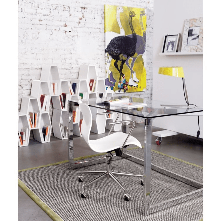 “Modern industrial home office with glass desk, chrome legs, white swivel chair, brick wall, geometric bookshelf, and bold abstract wall art.”