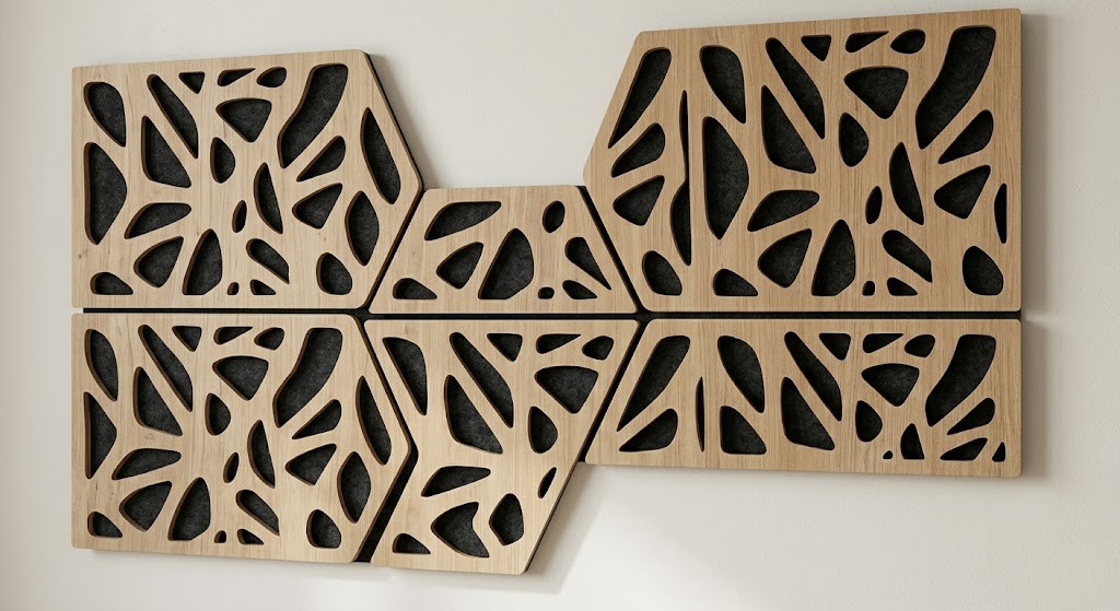 Detail shot of square, modular wood acoustic wall panels showing laser-cut fractal tessellations, designed as renter-friendly, sound-absorbing decor.